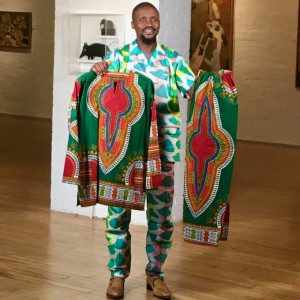 Ansumana with his clothing at Erie Art Museum