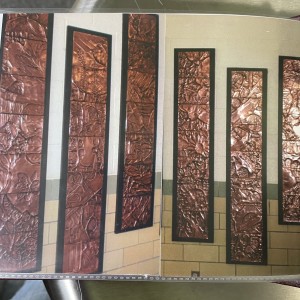 Copper Repousse’ panels installed in middle school hallway. 